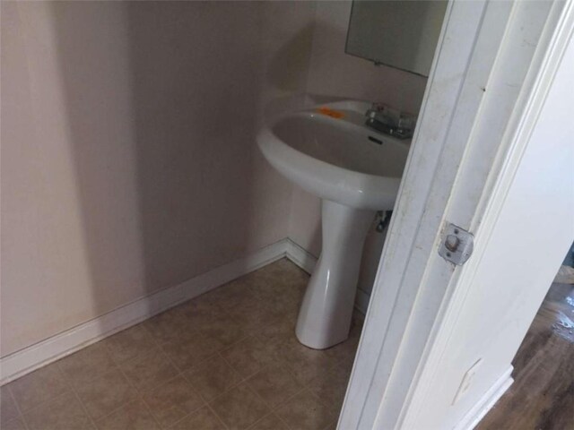 bathroom with tile flooring