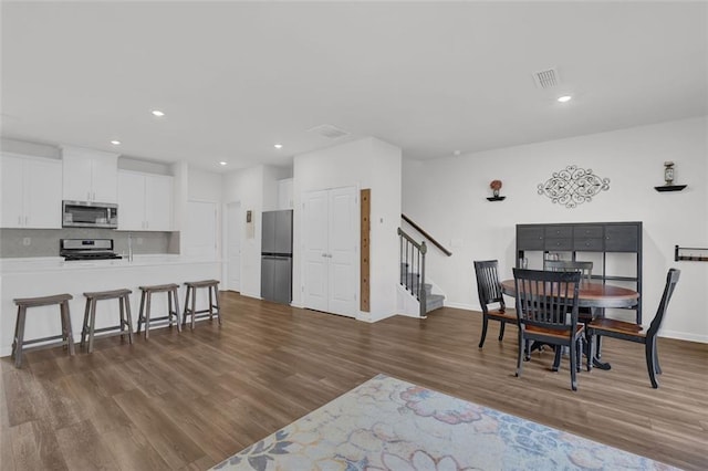 dining area featuring dark hardwood / wood-style flooring