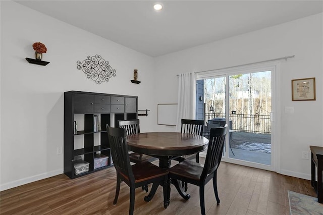 dining area featuring dark wood-type flooring