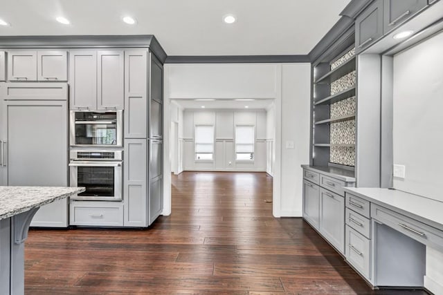 kitchen with gray cabinetry, recessed lighting, open shelves, and dark wood-type flooring