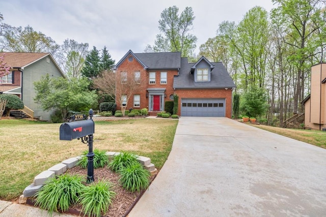 colonial-style house with brick siding, driveway, a garage, and a front lawn