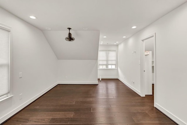 bonus room featuring dark wood-style flooring, baseboards, lofted ceiling, and recessed lighting
