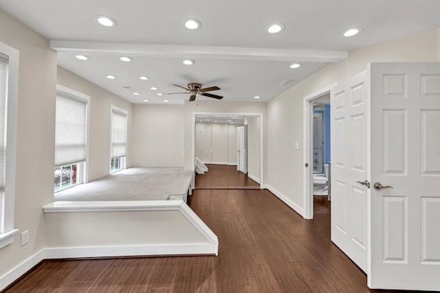 hallway with baseboards, beamed ceiling, recessed lighting, and dark wood-style flooring