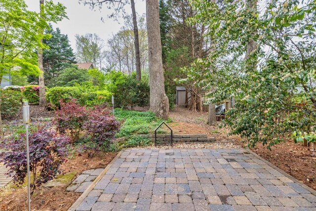 view of patio featuring an outbuilding