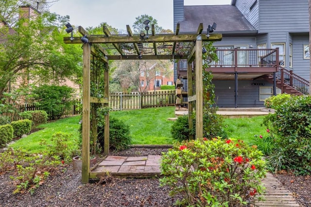 view of yard with stairs, fence, a wooden deck, and a pergola