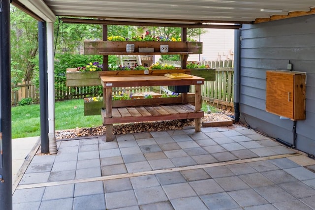 view of patio / terrace featuring fence