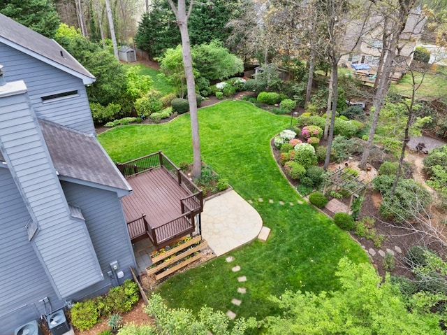 view of yard with cooling unit and a wooden deck