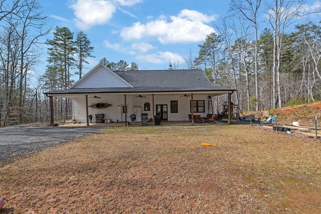 rear view of house with central AC unit, ceiling fan, and a patio area