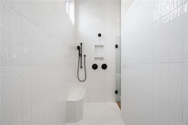 bathroom featuring tiled shower