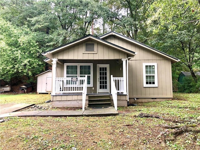116 Nation Dr, Calhoun, GA 30701 - view of front of home with covered porch and a shed