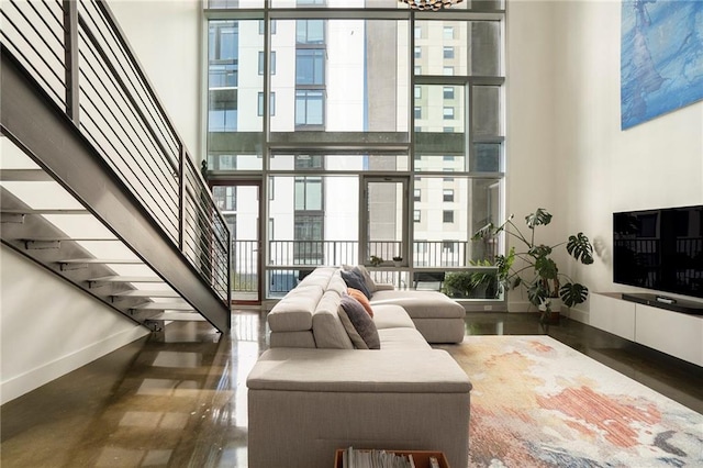 living room with a towering ceiling