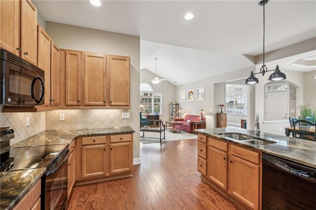 kitchen with dark hardwood / wood-style flooring, ceiling fan, sink, black appliances, and decorative light fixtures