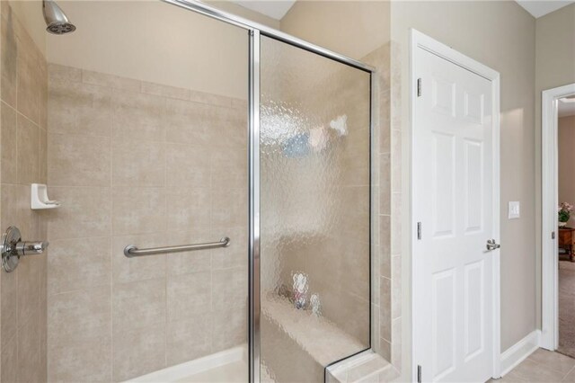 bathroom featuring tile patterned floors and walk in shower