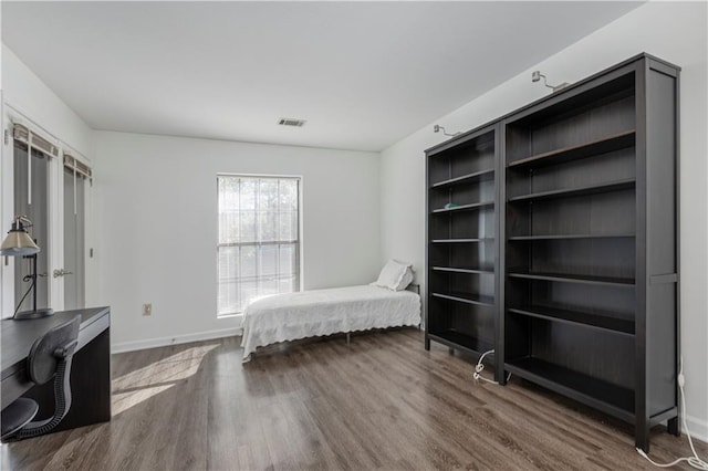 bedroom featuring hardwood / wood-style floors