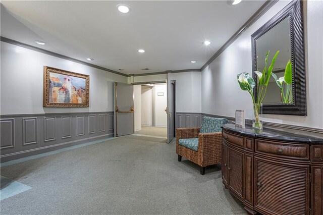 living area with light carpet and crown molding