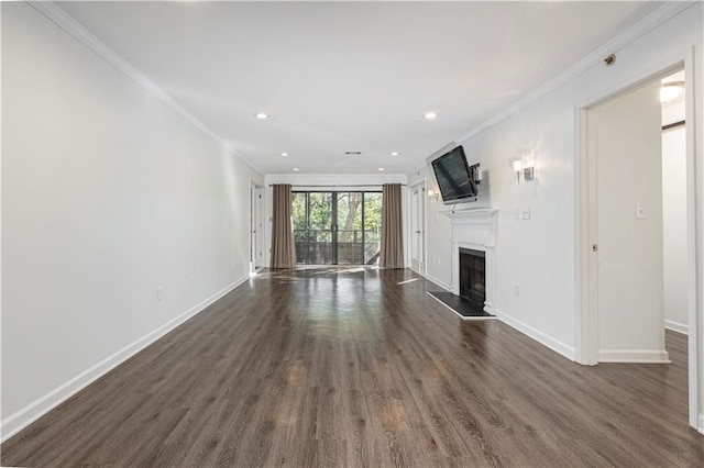 unfurnished living room with crown molding and dark wood-type flooring