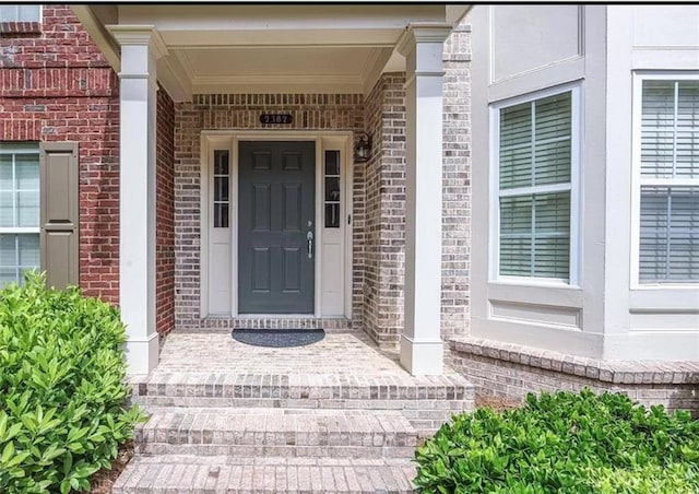 townhome / multi-family property with a garage and a balcony