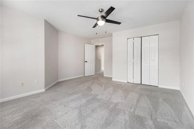 unfurnished bedroom with carpet and baseboards