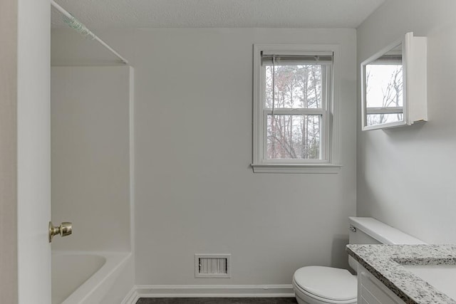 full bath featuring visible vents, toilet, a textured ceiling, baseboards, and vanity