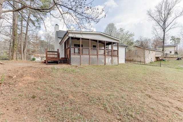 exterior space featuring a yard and a chimney