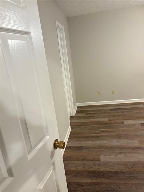 9161 Fairway Ct, Riverdale, GA 30274 - empty room with baseboards and dark wood-type flooring