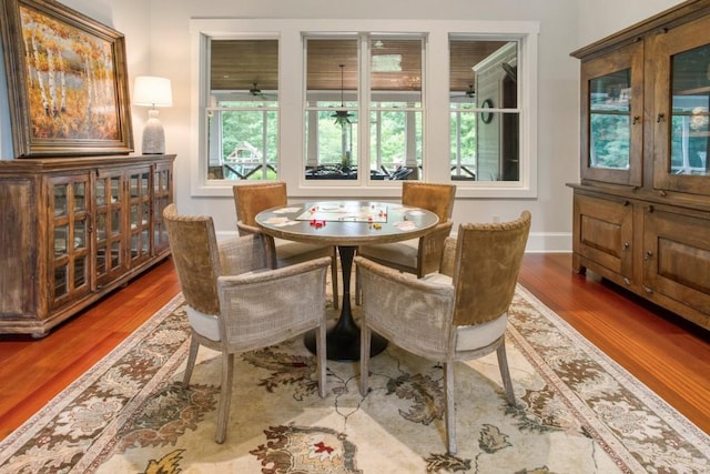 dining room with dark wood-type flooring