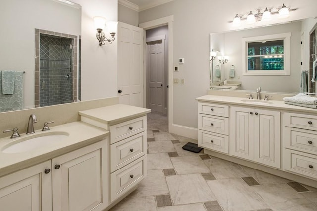 bathroom with vanity, ornamental molding, and a shower with shower door