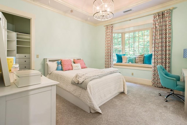 bedroom with a raised ceiling, crown molding, light colored carpet, and a chandelier