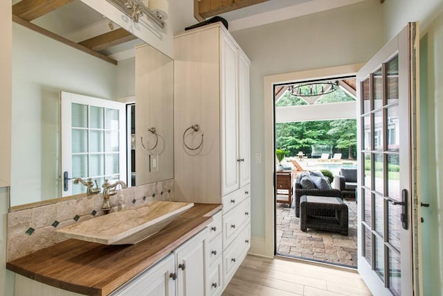 bathroom featuring wood-type flooring and vanity