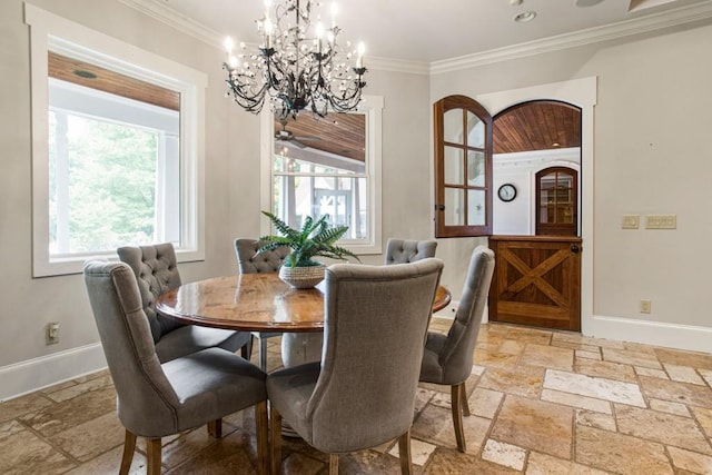 dining area featuring crown molding and a chandelier