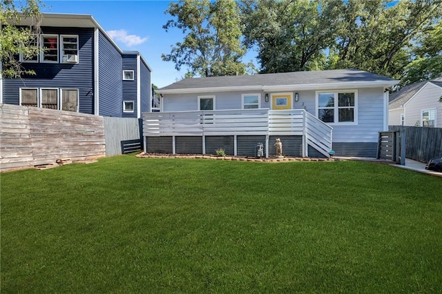 rear view of house with a lawn