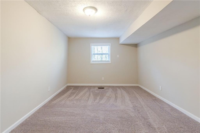 4412 Rustic Wood Dr, Stone Mountain, GA 30083 - empty room featuring carpet flooring and a textured ceiling