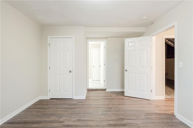 4412 Rustic Wood Dr, Stone Mountain, GA 30083 - unfurnished bedroom featuring wood-type flooring