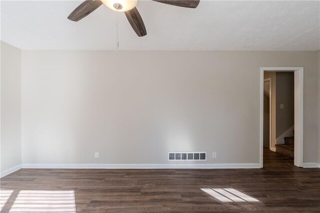 4412 Rustic Wood Dr, Stone Mountain, GA 30083 - spare room with ceiling fan and dark wood-type flooring