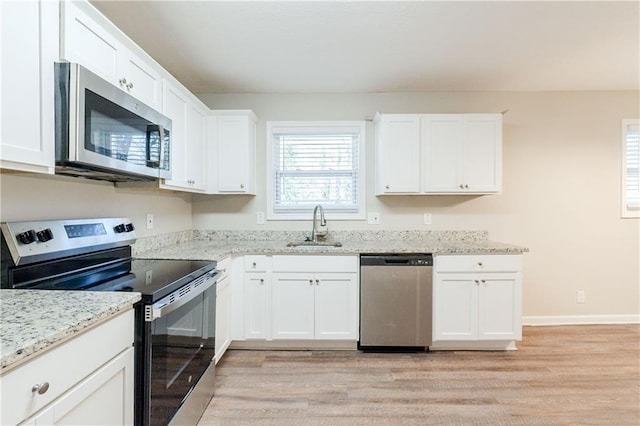 4412 Rustic Wood Dr, Stone Mountain, GA 30083 - kitchen featuring white cabinets, appliances with stainless steel finishes, and sink