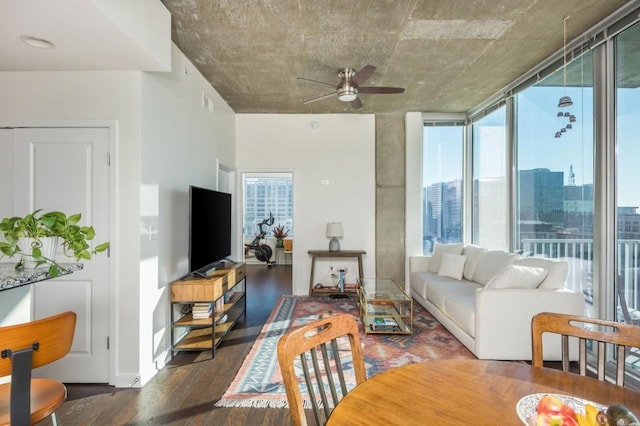 living room featuring plenty of natural light, a ceiling fan, and wood finished floors