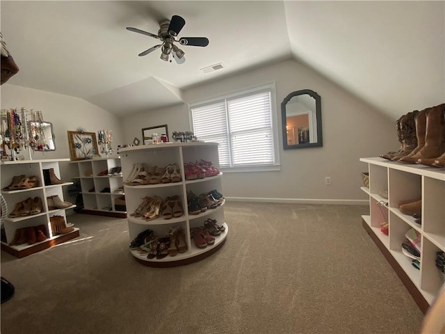 rec room with ceiling fan, lofted ceiling, and carpet