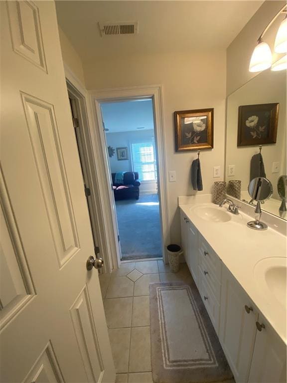 bathroom featuring tile patterned floors and vanity