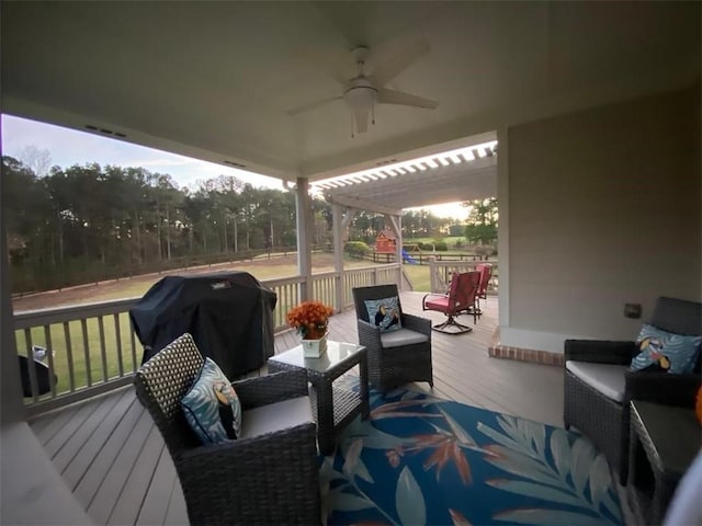 deck featuring area for grilling, a playground, outdoor lounge area, and ceiling fan