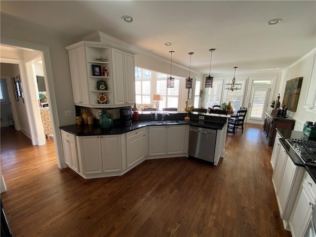 kitchen with white cabinetry, crown molding, decorative light fixtures, stainless steel dishwasher, and kitchen peninsula