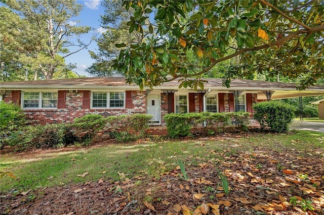 single story home with brick siding and an attached carport