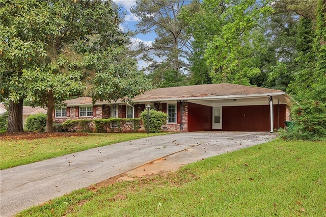 ranch-style house with a front lawn, an attached carport, and driveway