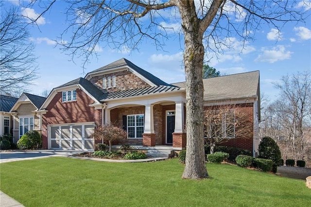 view of front of home with a front yard and a garage