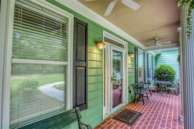 doorway to property featuring ceiling fan and covered porch