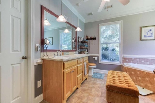 bathroom featuring crown molding, toilet, ceiling fan, a relaxing tiled tub, and vanity