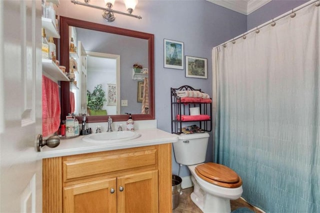 bathroom featuring crown molding, vanity, toilet, and tile patterned flooring