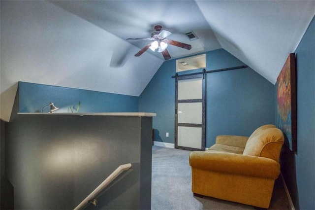 sitting room with lofted ceiling, ceiling fan, and carpet