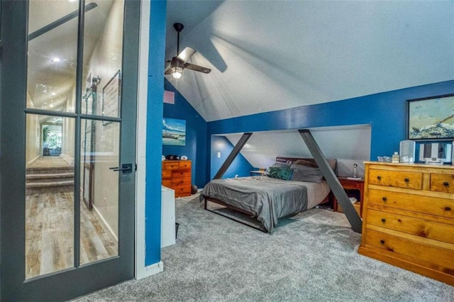 bedroom with ceiling fan, carpet, and vaulted ceiling