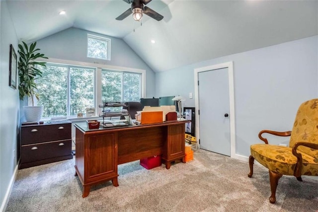 office space featuring plenty of natural light, ceiling fan, and light colored carpet