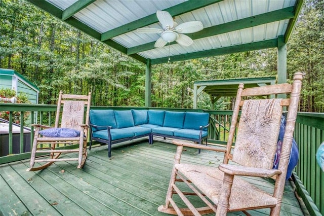 deck with an outdoor living space and ceiling fan